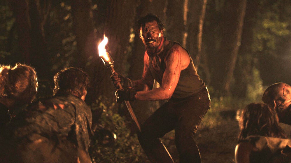 A man with a flaming torch