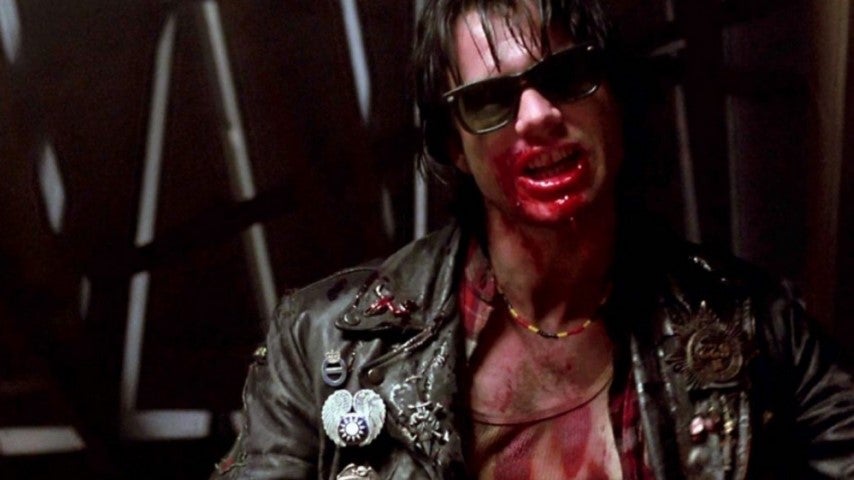 a sunglasses wearing vamp with blood on his mouth