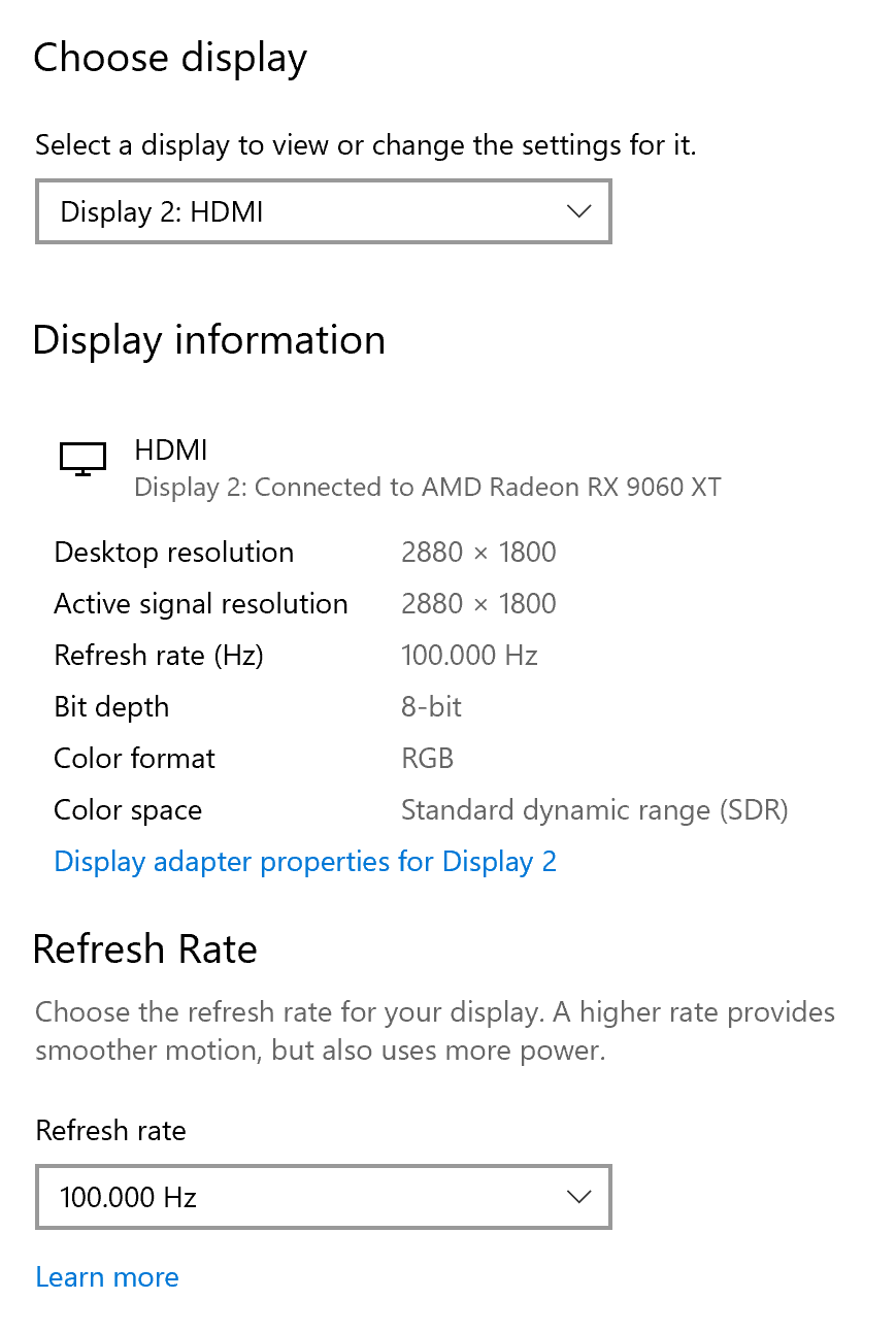 Φωτεινή φορητή οθόνη OLED 16 ιντσών 3K Ένα παράθυρο ρυθμίσεων εμφανίζει την Οθόνη 2 συνδεδεμένη μέσω HDMI σε AMD Radeon RX 9060 XT με ανάλυση επιφάνειας εργασίας 2880 x 1800 και ρυθμό ανανέωσης 100.000 Hz.