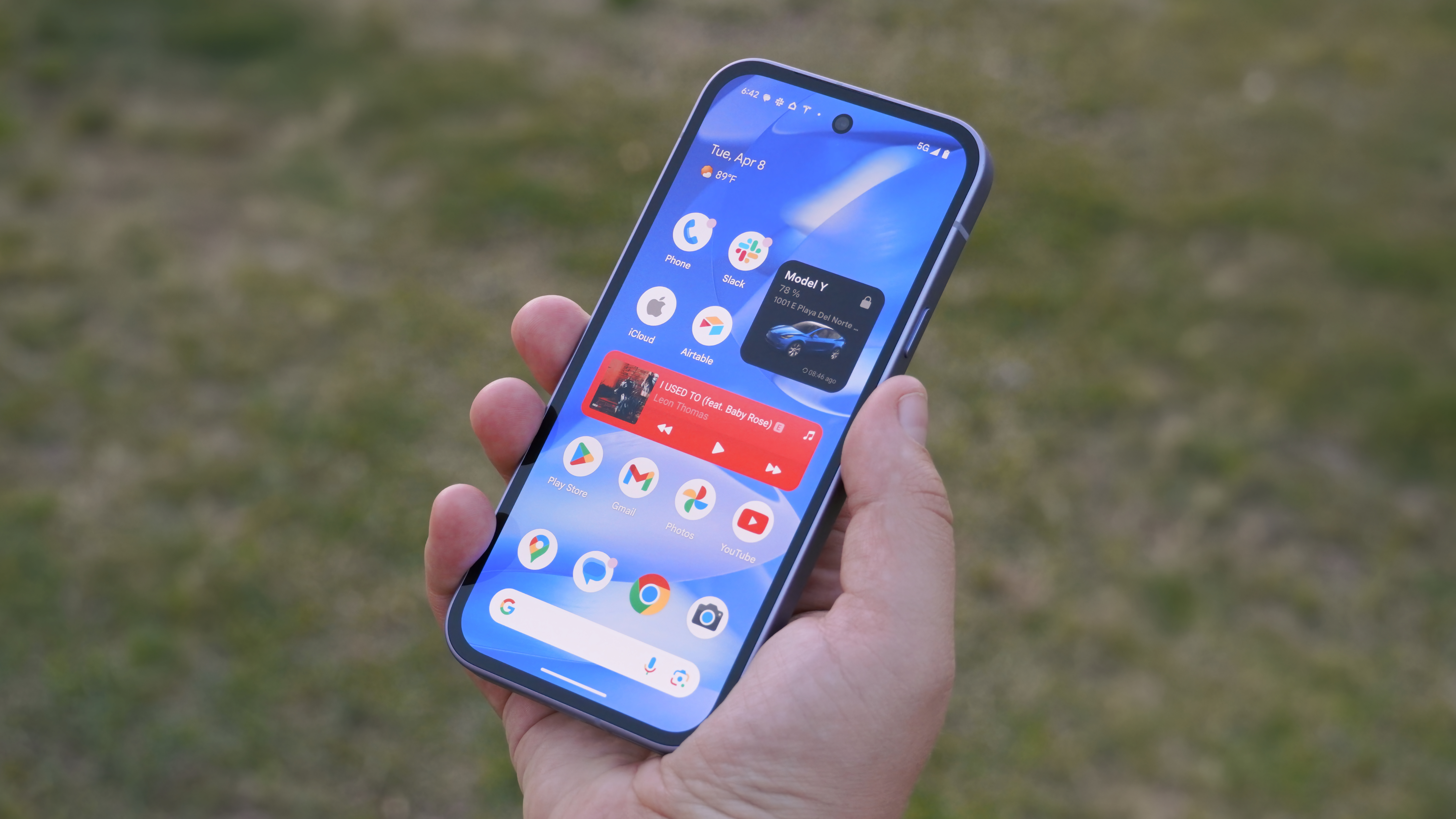 The Google Pixel 9a in Iris in the hand.