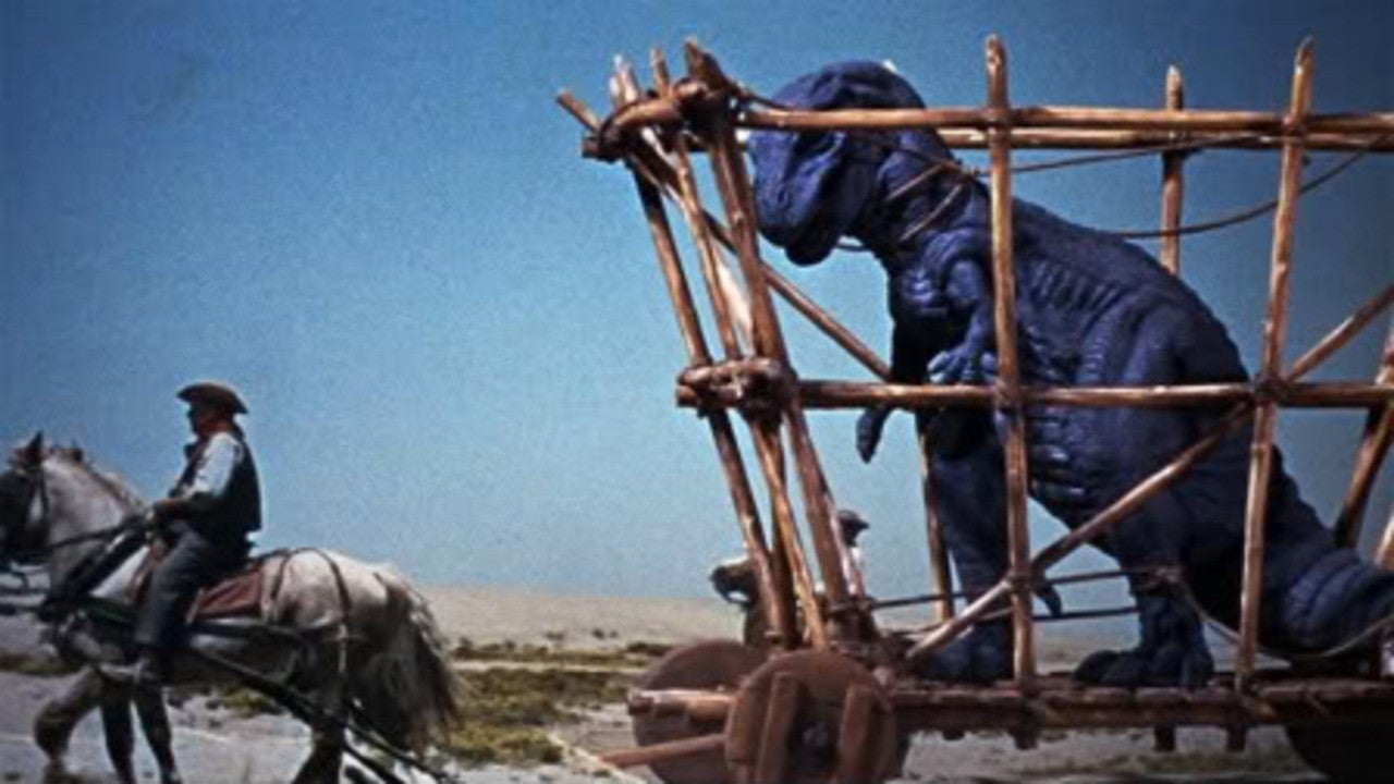 «Οι 10 Επικότερες Ταινίες Με Δεινοσαύρους Που Δεν Πρέπει Να Χάσεις!» Ένας δεινόσαυρος σε ένα κλουβί