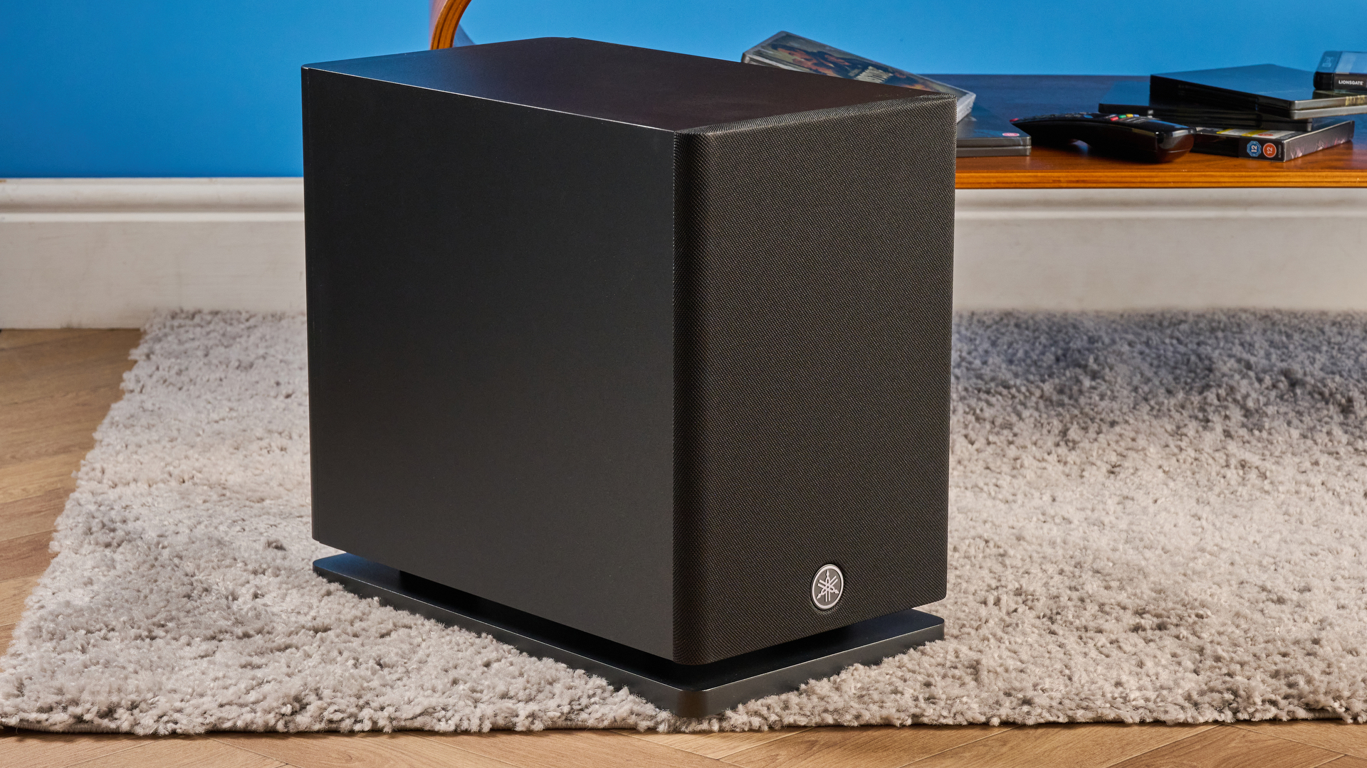 the yamaha true x surround 90a soundbar with dolby atmos, subwoofer, surround rear wireless speakers, and a 5.1.4 channel configuration photographed alongside a TV