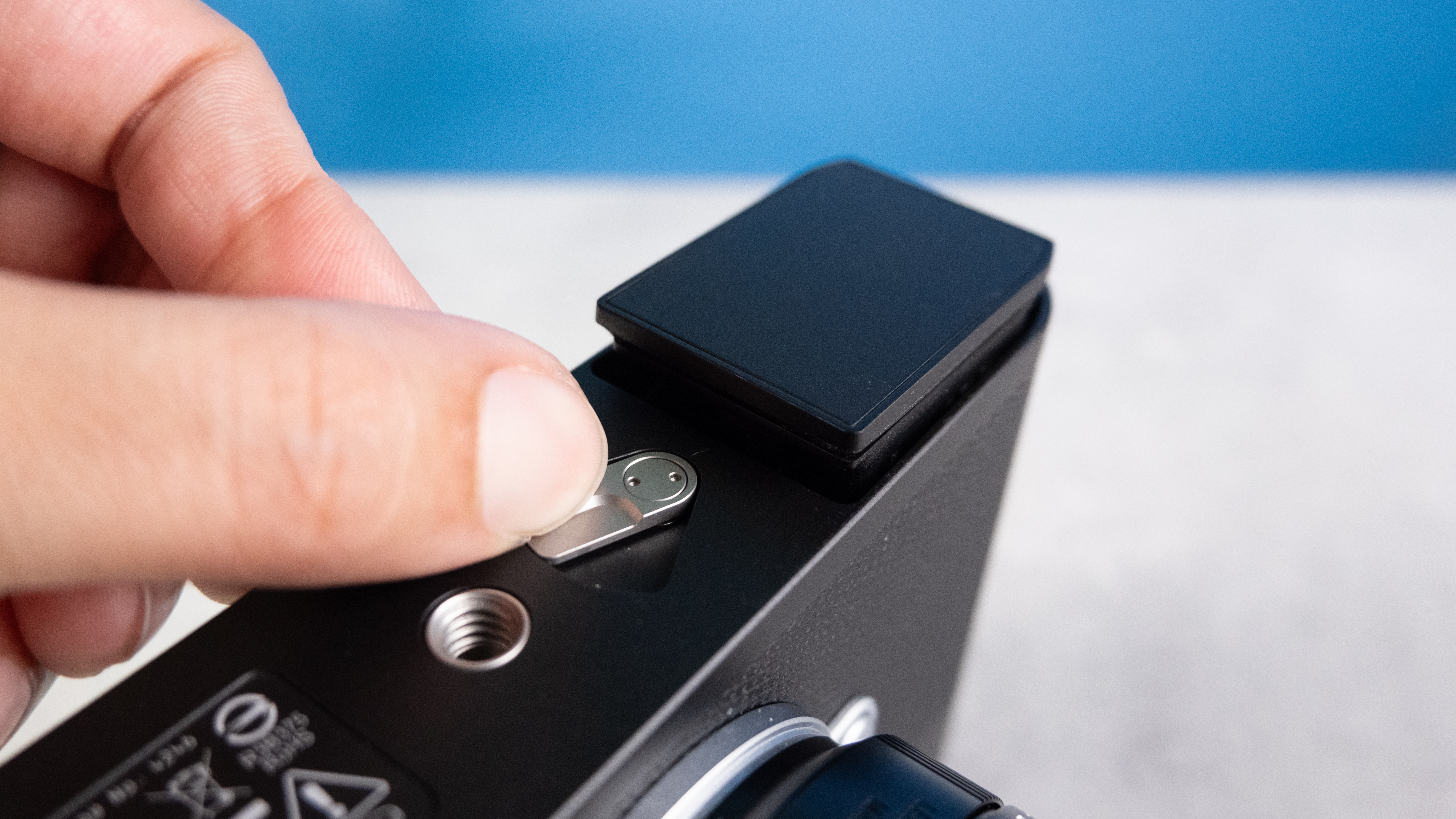 A black Leica M EV1 rangefinder-style camera