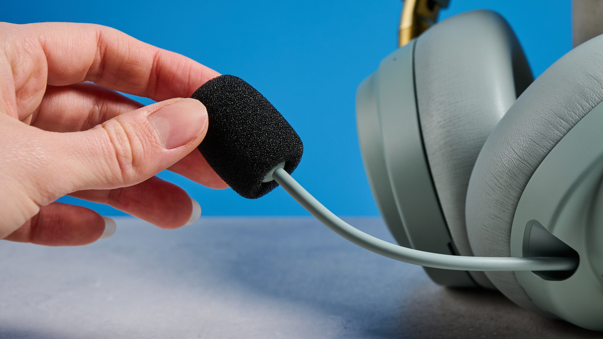 The SteelSeries Arctis Nova Elite with its boom mic been covered with a muffler