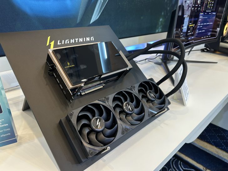 A graphics card labeled Lightning is mounted with a cooling system featuring three fans, displayed on a stand with the 'LIGHTNING' logo.