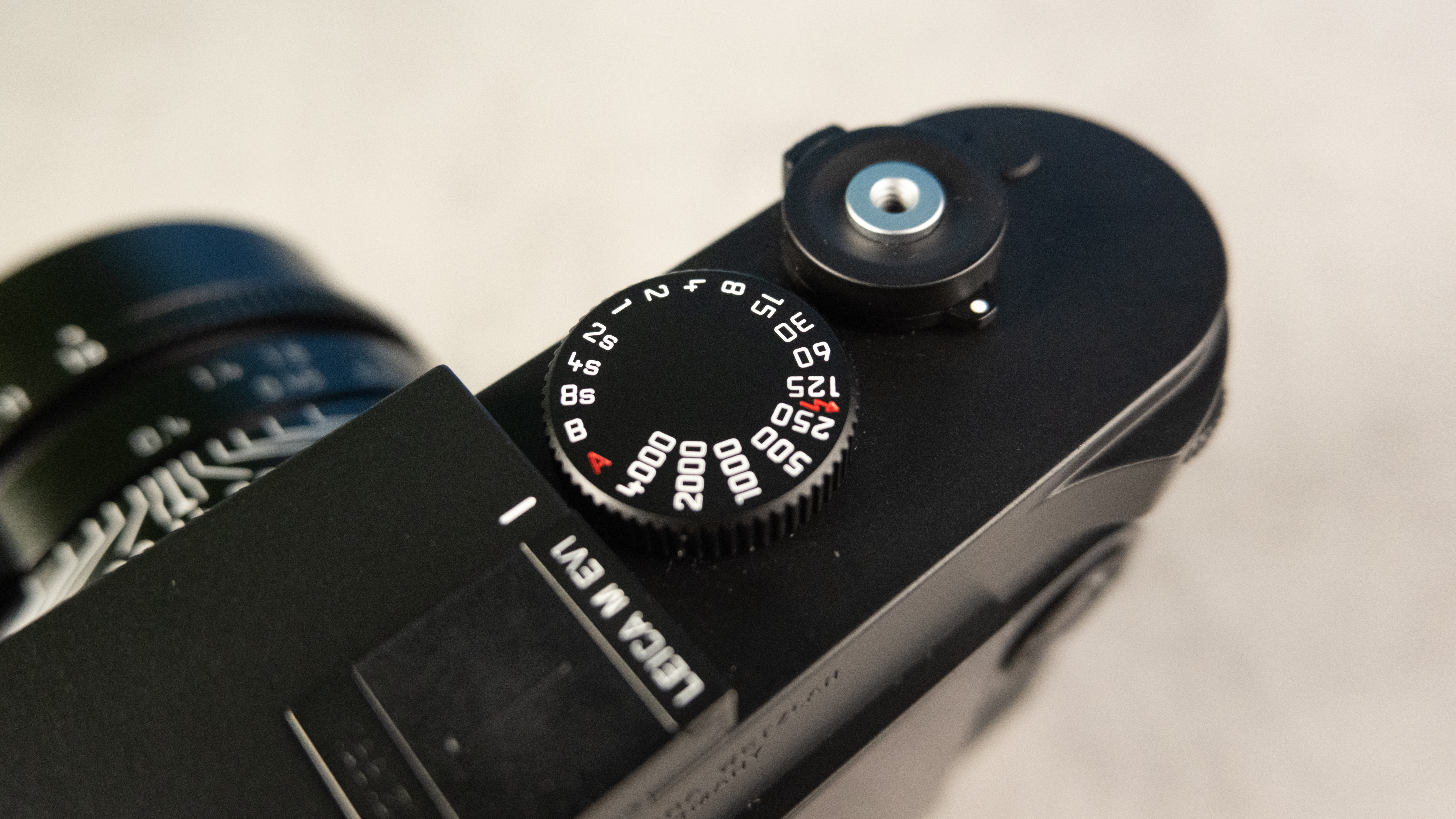 A black Leica M EV1 rangefinder-style camera