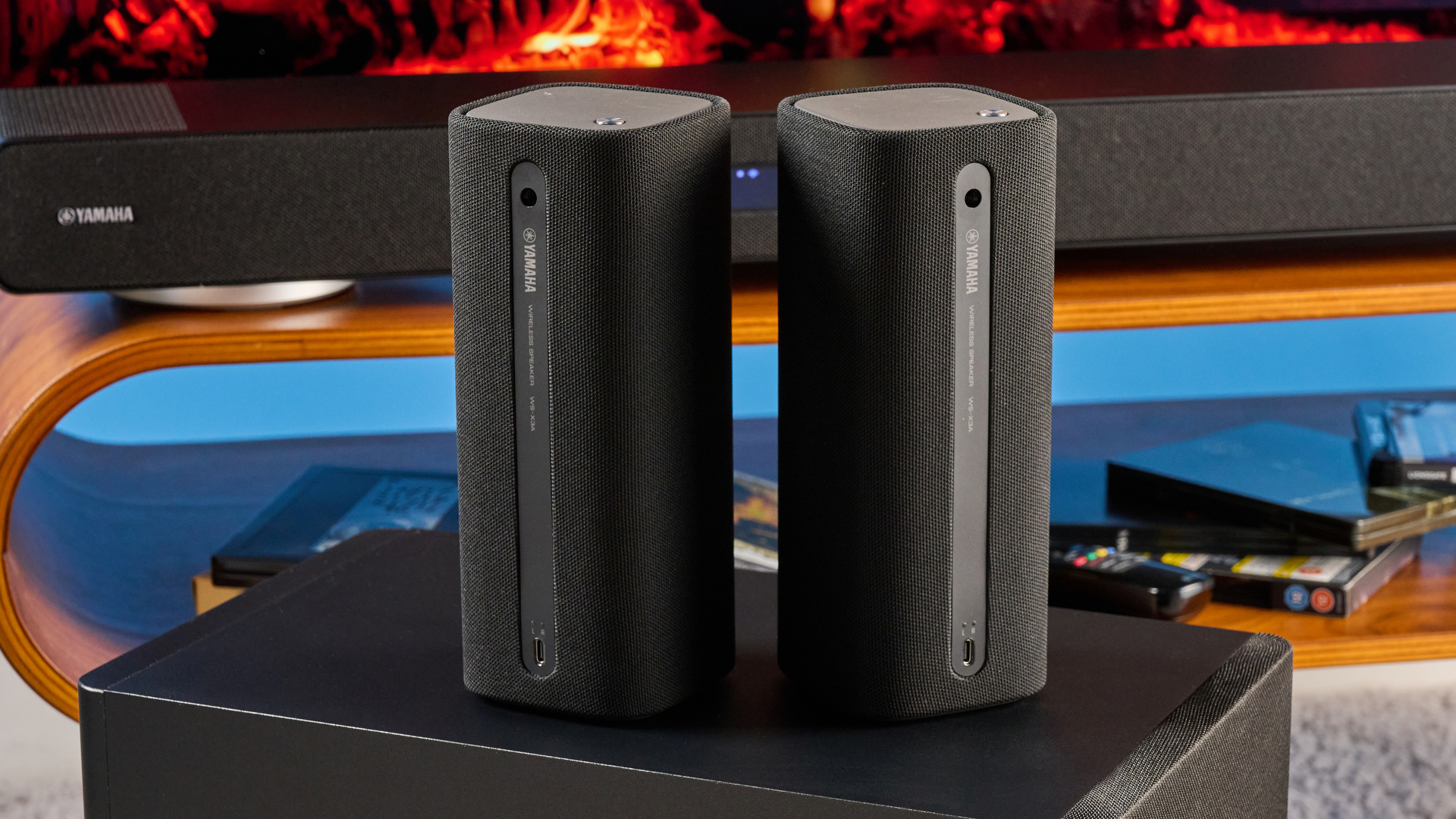 the yamaha true x surround 90a soundbar with dolby atmos, subwoofer, surround rear wireless speakers, and a 5.1.4 channel configuration photographed alongside a TV