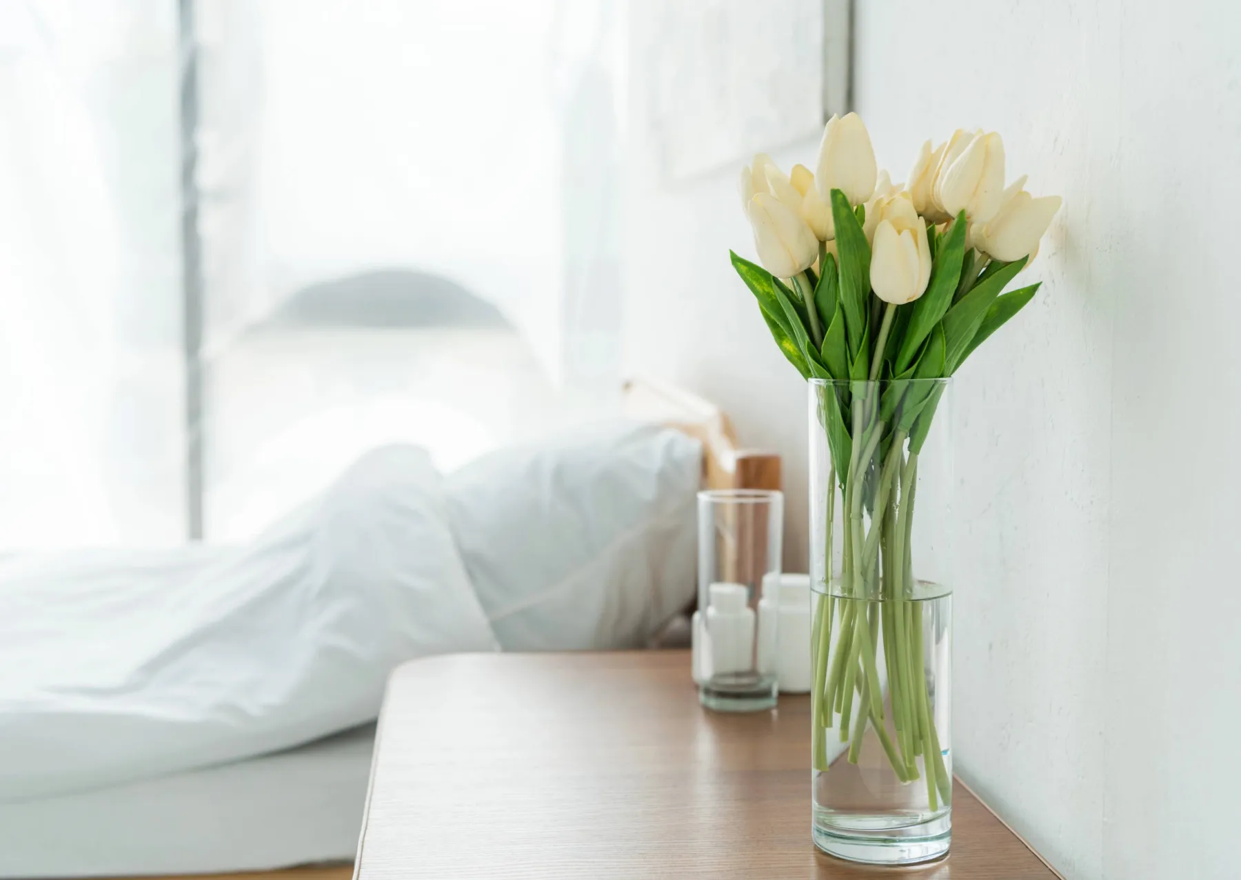 Why humans live and die for love an empty hospital bed with flowers by a table