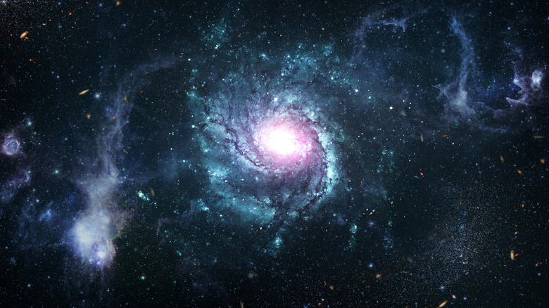 μια εικόνα του διαστήματος με αστέρια, πλανήτες και γαλαξίες