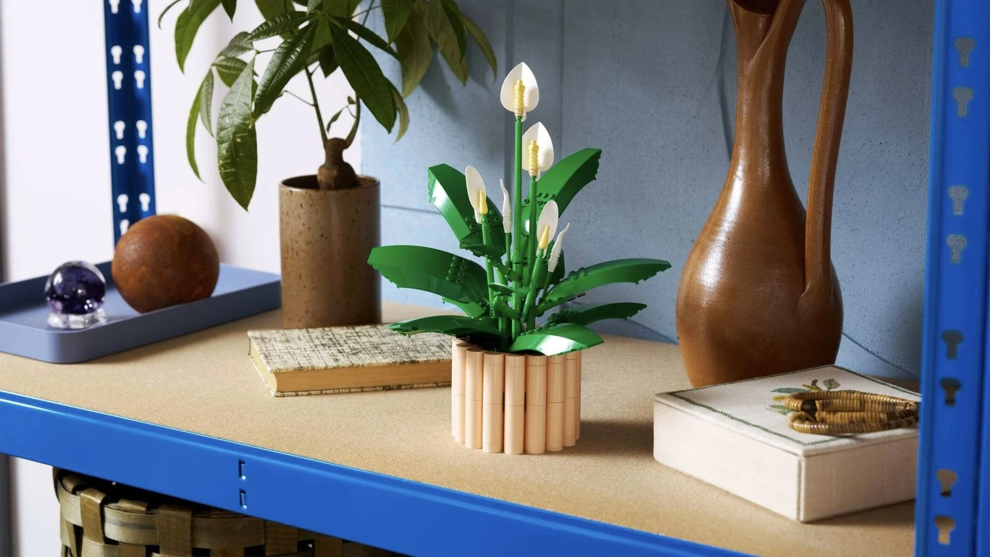 lego peace lily on blue and wooden shelving unit