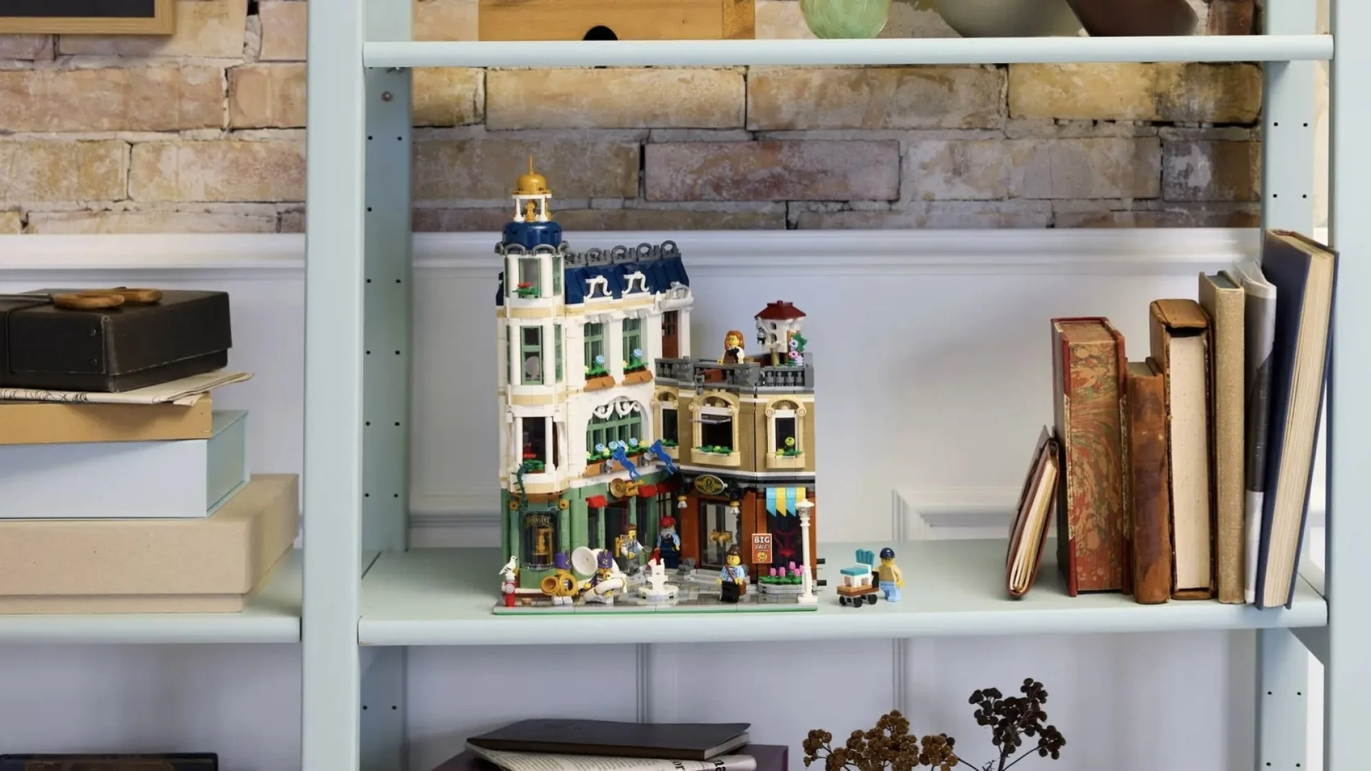 Lego Icons Shopping Street set on light blue bookshelf